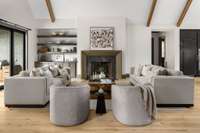 Alternate view of the living room highlighting the elegant fireplace and timeless mantel—adding warmth and sophistication to the heart of the home.