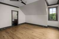 Another bedroom showcasing its spacious layout, soft natural light, and thoughtful design details.