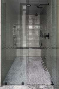 Spacious walk-in steam double shower with dual shower heads—designed for everyday luxury and a spa-like experience at home.