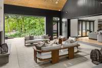 Enjoy year-round comfort on the covered patio, featuring retractable screens controlled by remote—perfect for indoor-outdoor living at the touch of a button.