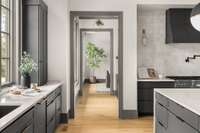 Inviting entryway to the heart of the home—offering a glimpse into the beautifully designed kitchen just beyond.