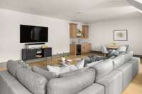 Versatile upstairs bonus room complete with a sleek wet bar and beverage fridge—perfect for relaxing, entertaining, or game night gatherings.