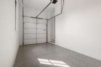 4 -car garage with high ceilings epoxy flooring, extra bay make this a garage enthusiast's paradise.