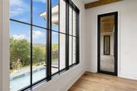 Wake up to spectacular views of the pool and the hills of Brentwood from your primary bedroom.