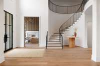 Impressive circular staircase in the two-story Foyer