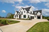 This stunning home feature breathtaking views, spacious 4-car garage and a graceful circular driveway.