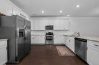 Timeless, white cabinetry and neutral counter tops.
