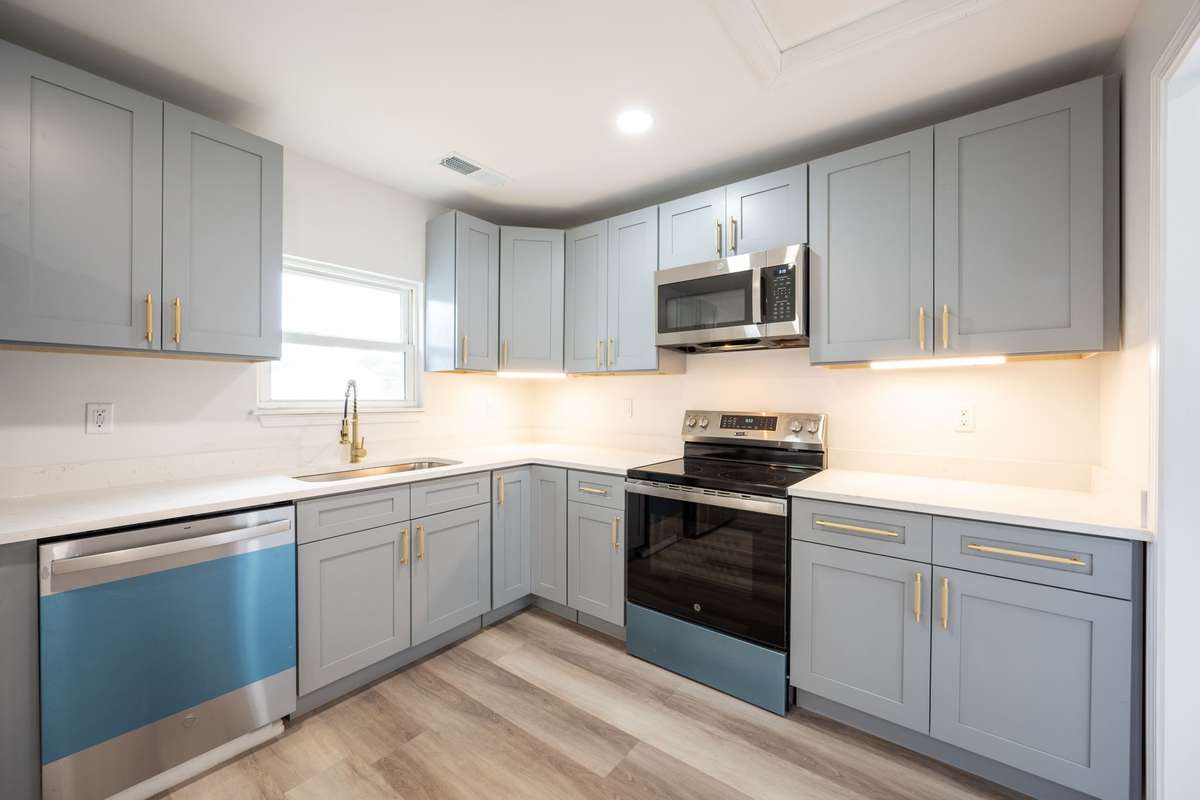 New cabinets, quartz counter tops, GE Stainless Steel Refrigerator, Range, Dishwasher, and Microwave.  New LVP flooring, paint, and fixtures!