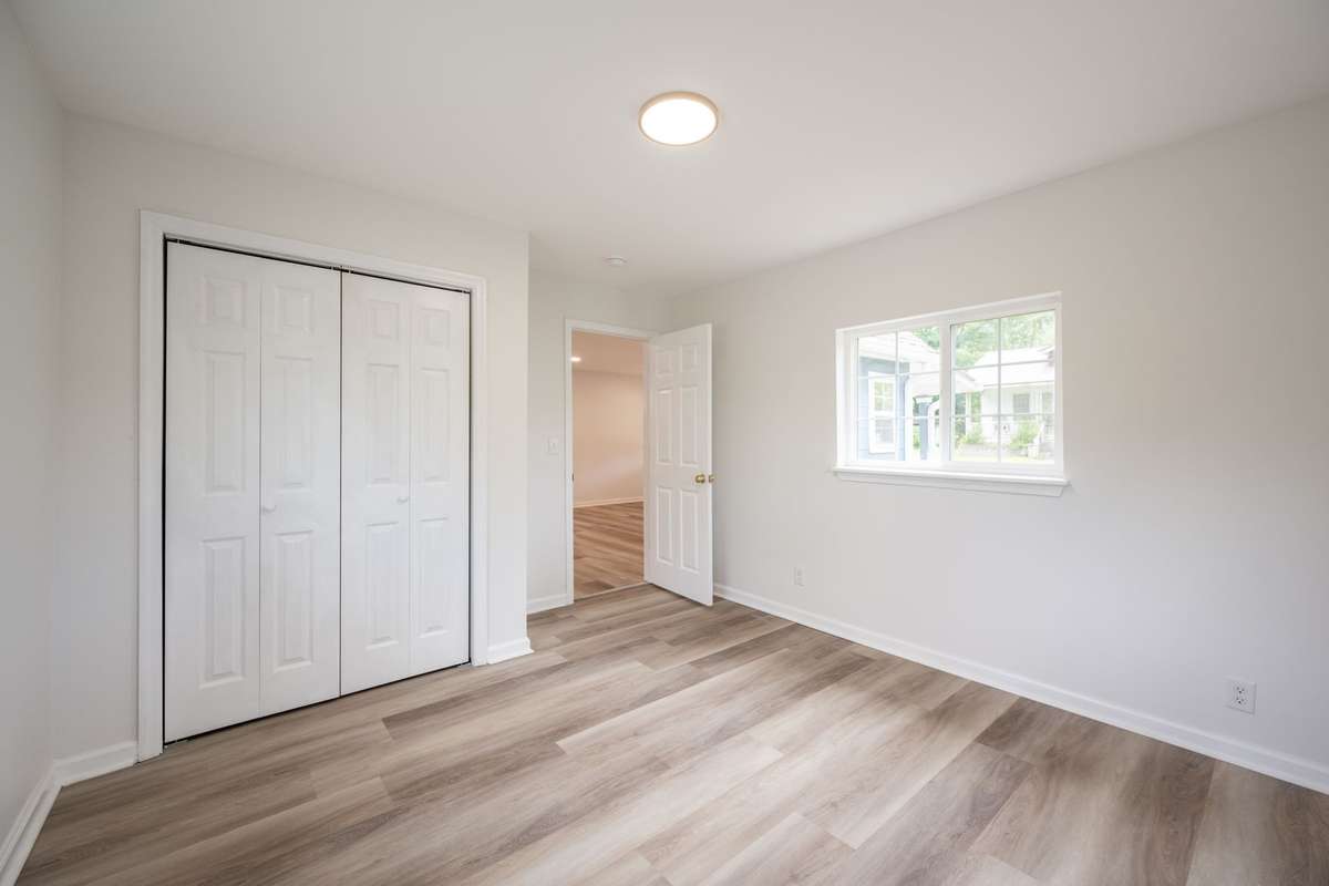Fresh paint, new LVP flooring, new sub-flooring, new windows and light fixtures shown here!