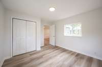 Fresh paint, new LVP flooring, new sub-flooring, new windows and light fixtures shown here!