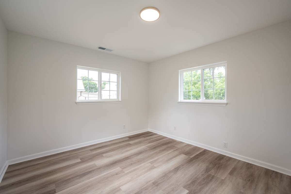 Fresh paint, new LVP flooring, new sub-flooring, new windows and light fixtures shown here!