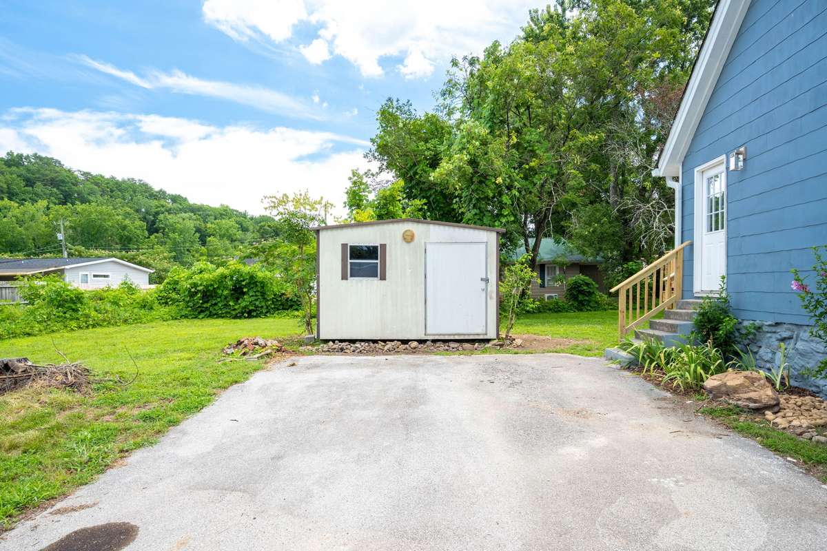 Ample parking on the concrete driveway, New roof and exterior paint.  The shed conveys with the property!