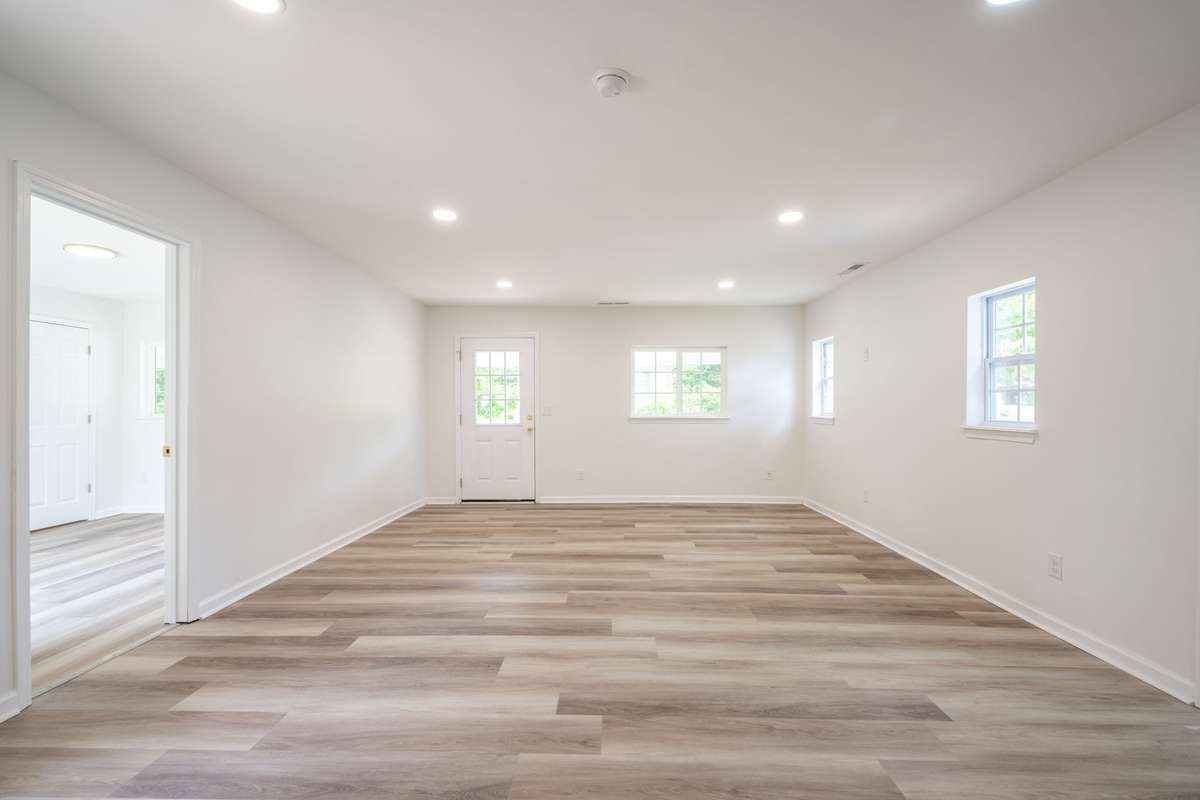 Fresh paint, new LVP flooring, new sub-flooring, new windows and light fixtures shown here!