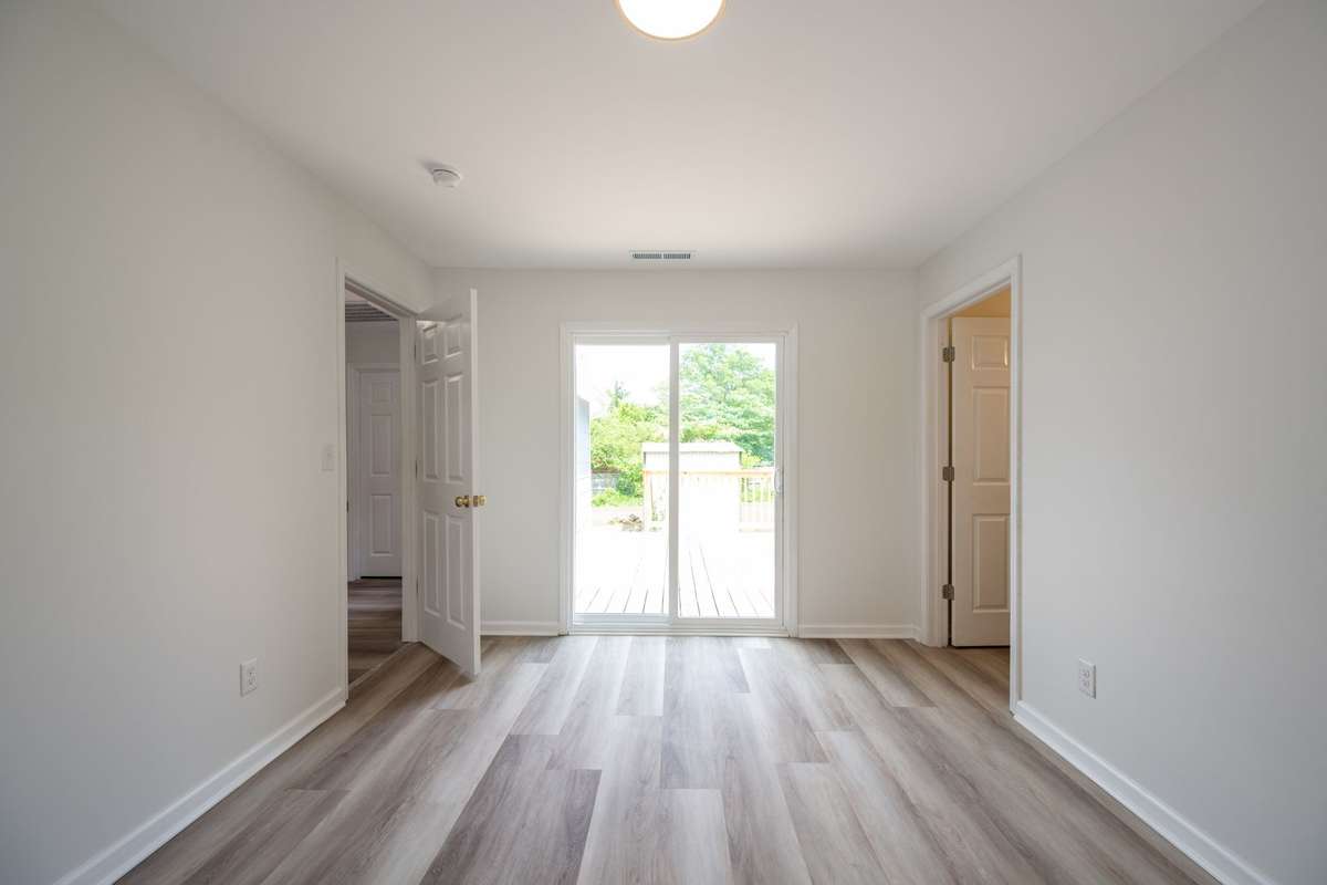 Fresh paint, new LVP flooring, new sub-flooring, new windows and light fixtures shown here!