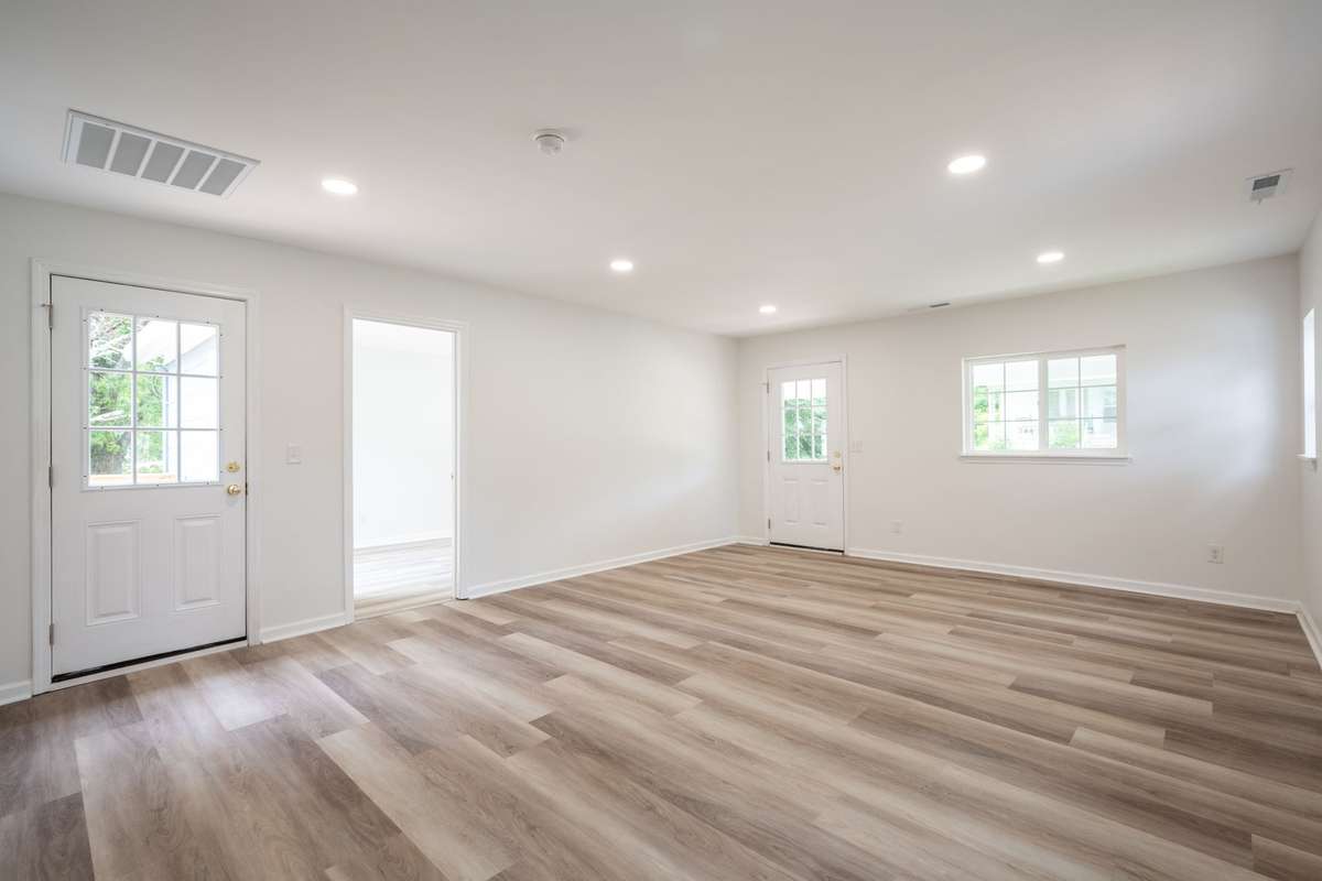 Fresh paint, new LVP flooring, new sub-flooring, new windows and light fixtures shown here!