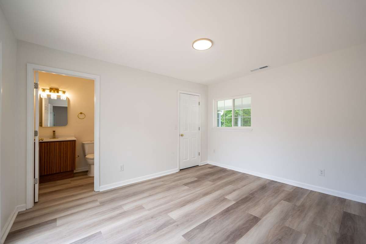 Spacious Tub/Shower Combo, brand new, along with new vanity, toilet, fixtures, flooring, and paint.
