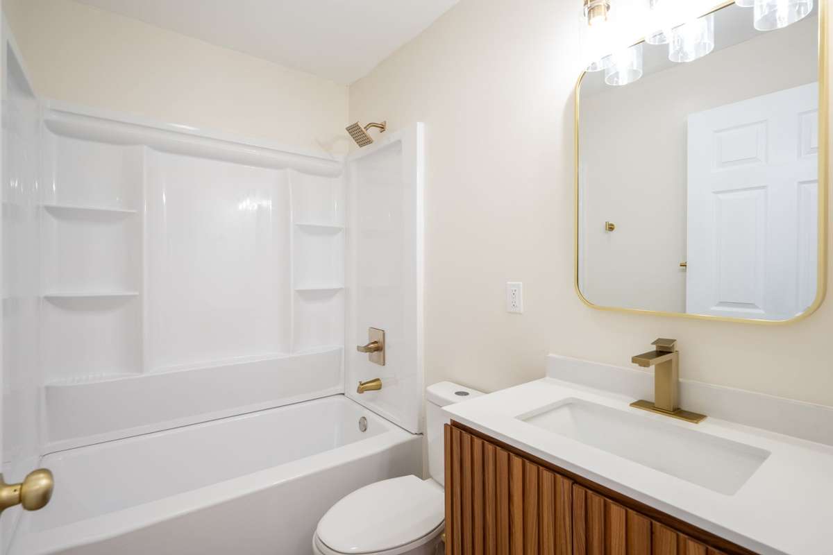 Spacious Tub/Shower Combo, brand new, along with new vanity, toilet, fixtures, flooring, and paint.