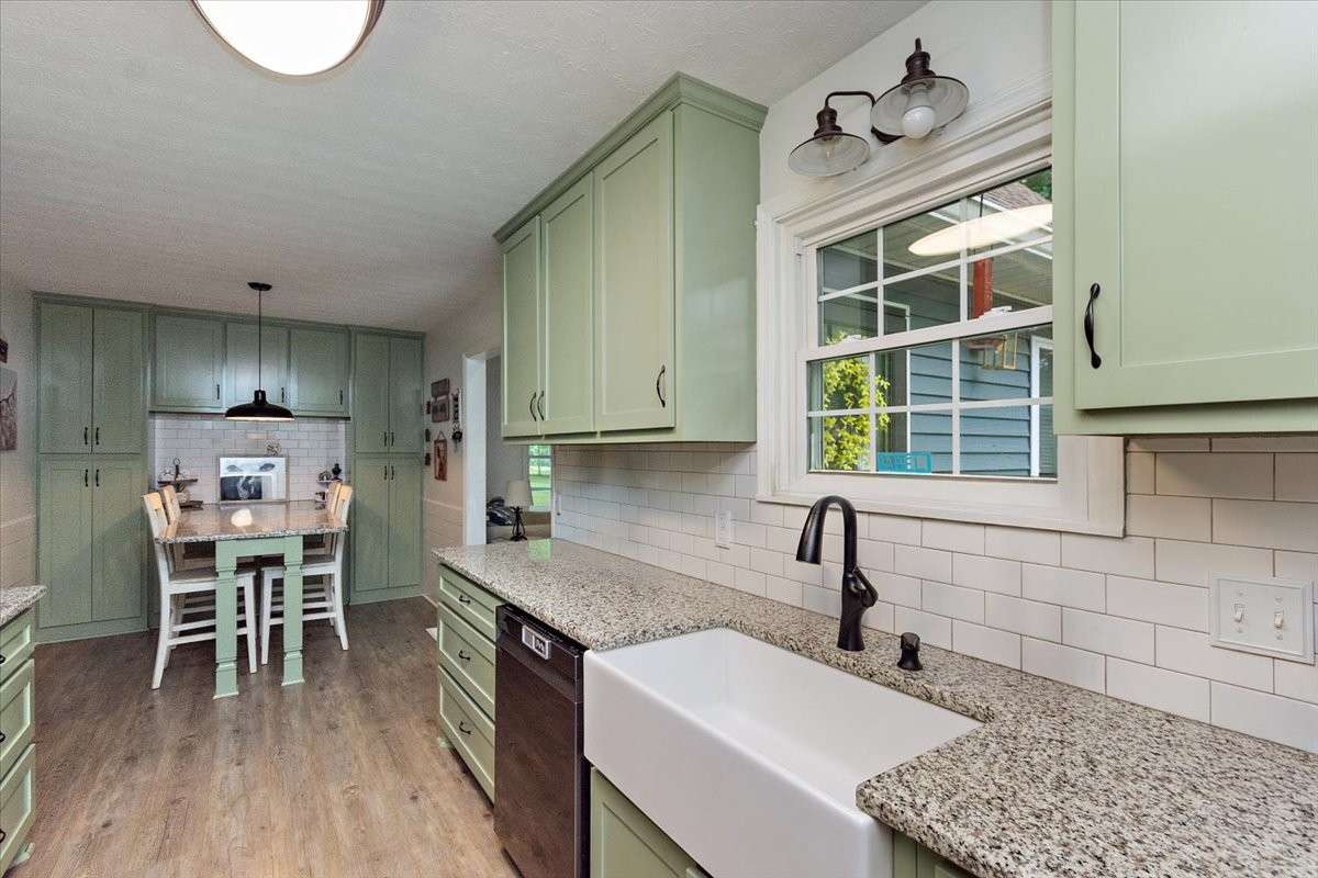 Beautiful Galley Kitchen (Farm Sink) & Breakfast Nook with built in Table & granite countertops.