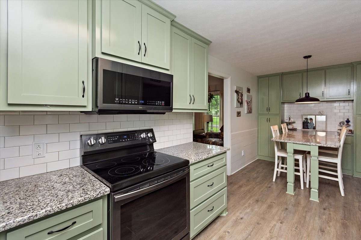 Beautiful Galley Kitchen (Farm Sink) & Breakfast Nook with built in Table & granite countertops.