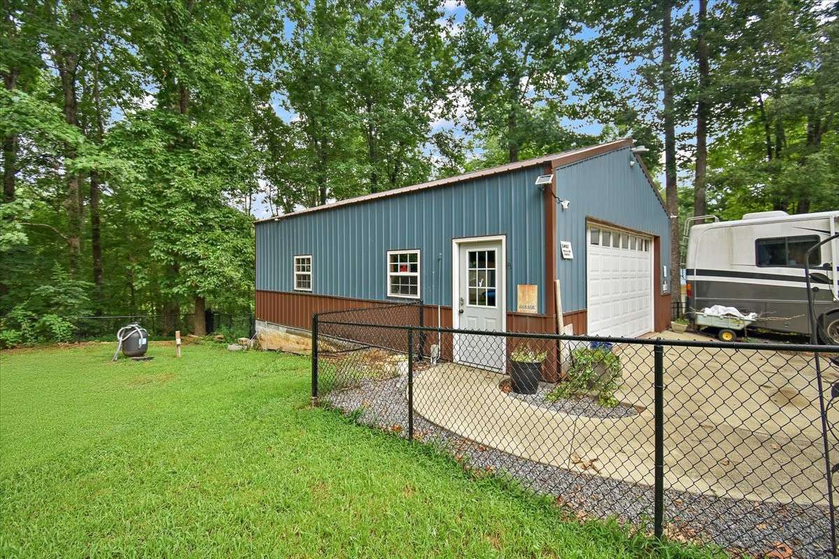 Enjoy this Detached, expansive 24x32 insulated garage, complete with 100 amp service, water, and a mini split HVAC—perfect for hobbies, storage, or a workshop.