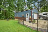 Enjoy this Detached, expansive 24x32 insulated garage, complete with 100 amp service, water, and a mini split HVAC—perfect for hobbies, storage, or a workshop.