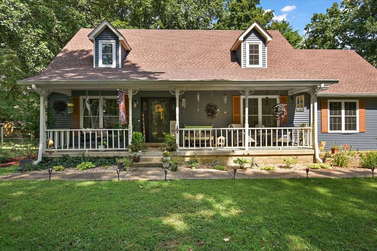 Enjoy relaxing on the inviting, rocking-chair front porch of this charming home, which features a freshly painted exterior for enhanced curb appeal. The property also includes a detached garage that has been recently painted to match.