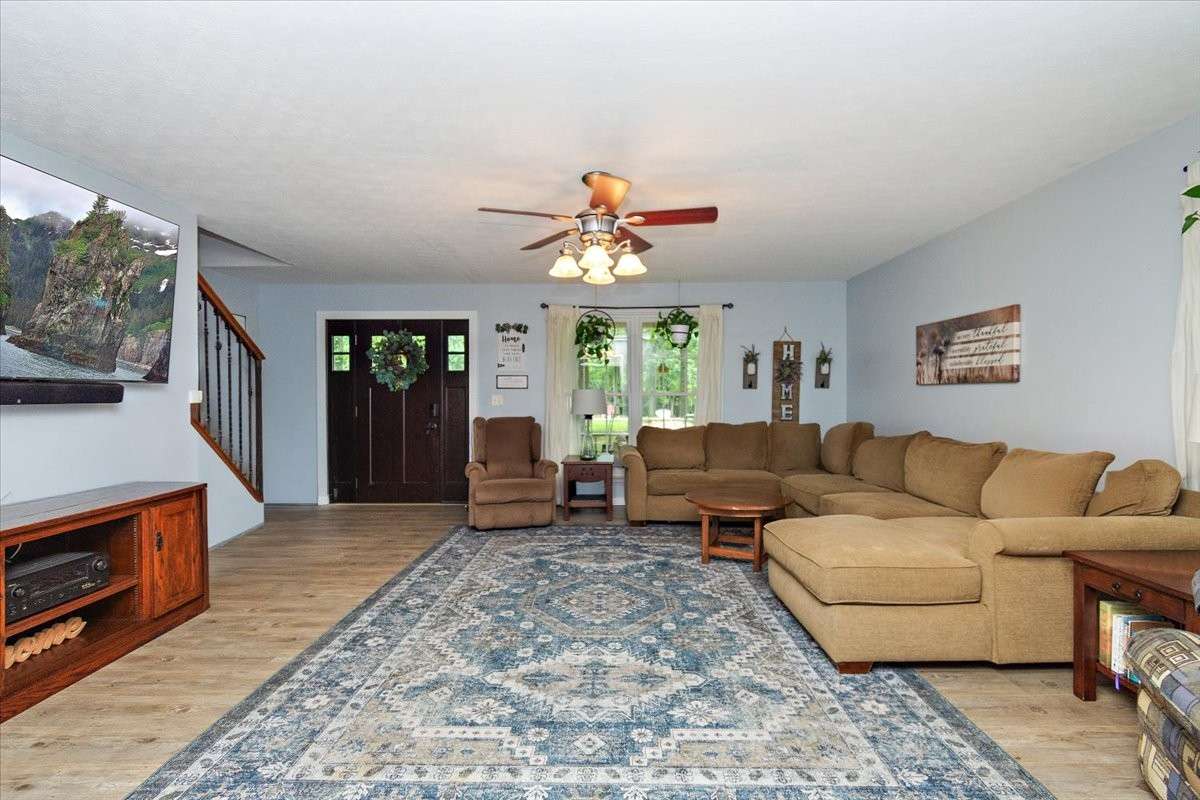 Living room is spacious and flows into kitchen and Family room. Beautiful updates throughout home, including LVP floorings and paint.
