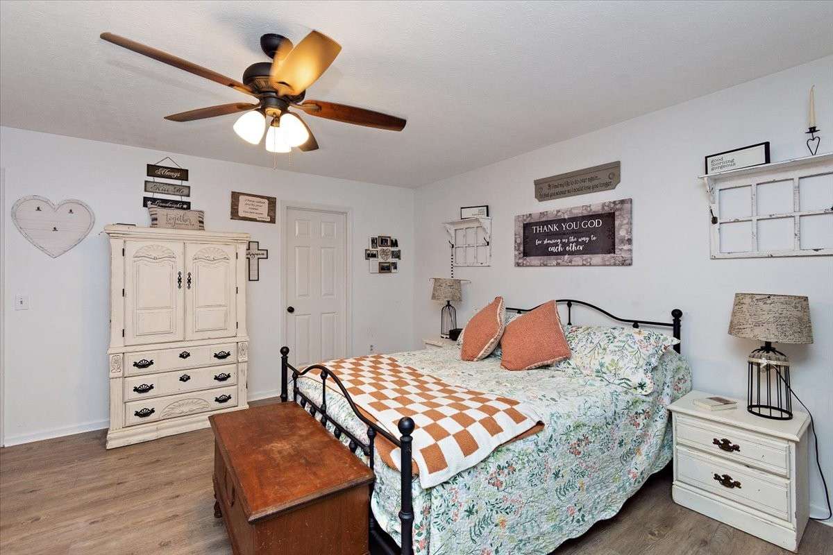 Primary Bedroom with LVP flooring.