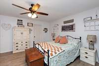Primary Bedroom with LVP flooring.