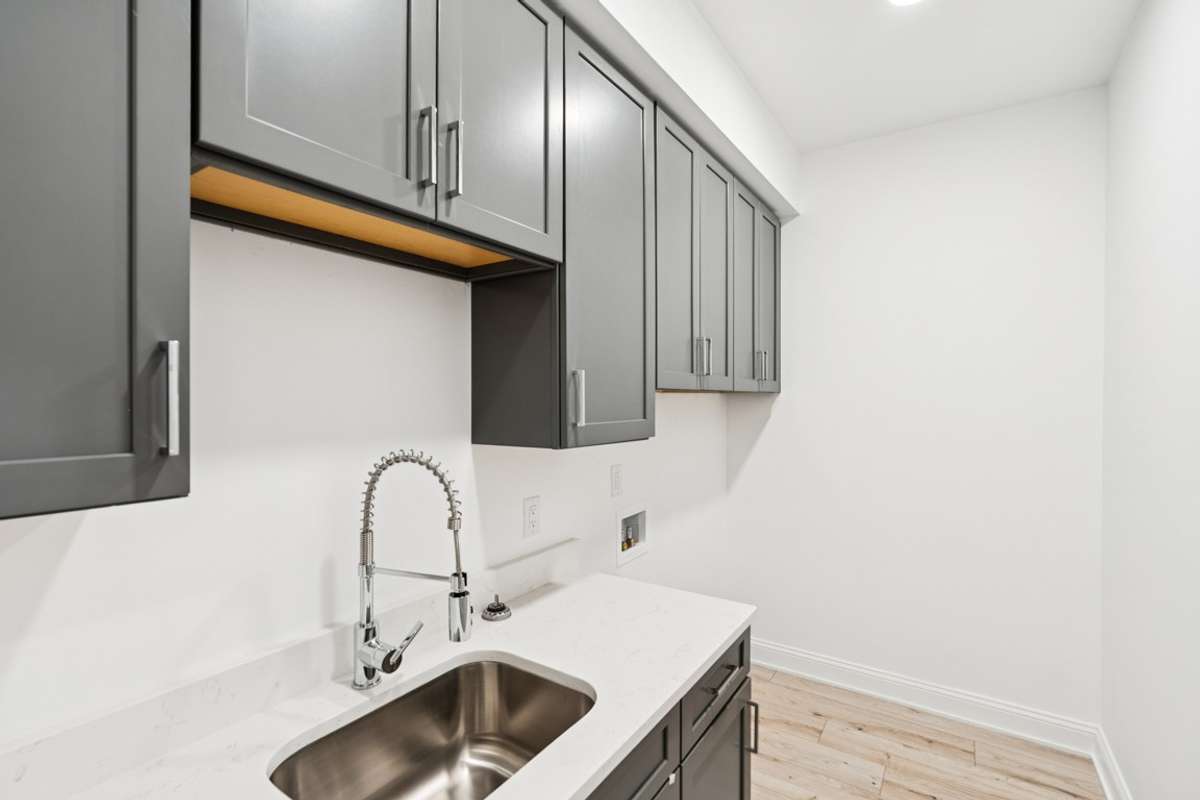 Laundry room with built in sink