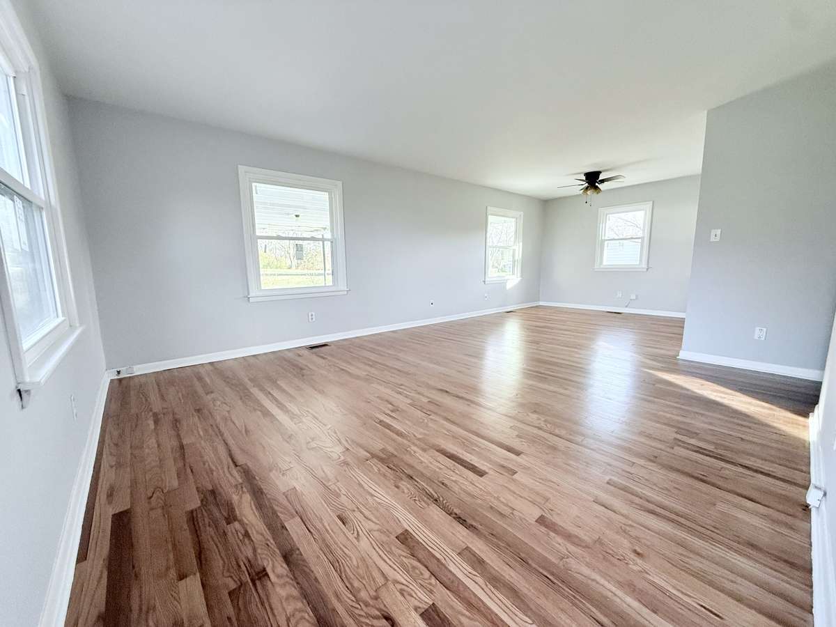 Spacious living area that is opened to the dinning room. Beautiful hardwood floors that have been refinished and fresh paint throughout