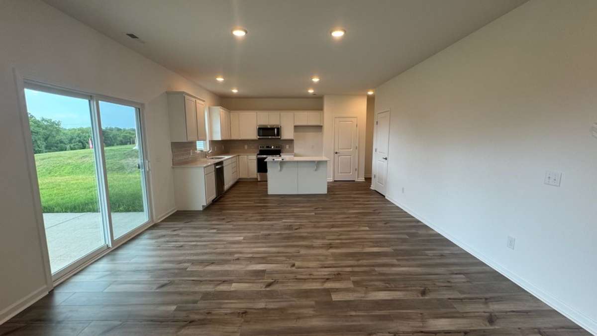 Spacious Open Concept Dining flows seamlessly into Kitchen