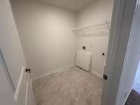 Large laundry room with tiled floor.
