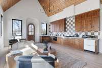 One of the most iconic features of this luxury property is the wholly private and separate apartment, in-law suite, or au pair living area attached to one side of the home. The suite also has laundry hookups.