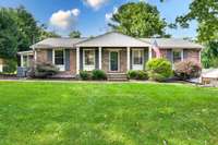 Welcome home to 4818 Merrill Lane, in the heart of Crieve Hall!