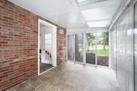 The sunroom is heated and cooled for year round enjoyment.