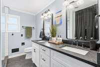 Primary bathroom with double vanity & crown molding. 1454 Indian Pl Murfreesboro TN 37129
