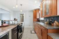 Another view of your kitchen with SS appliances, tile backsplash & modern drop lights. 1454 Indian Pl Murfreesboro TN 37129