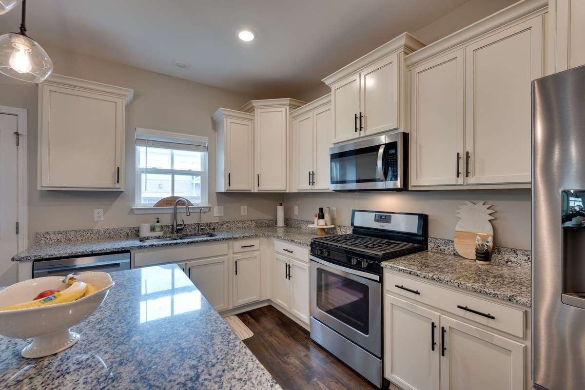 Beautiful chef's kitchen with ample storage, granite, gas cooktop and hardwood floors