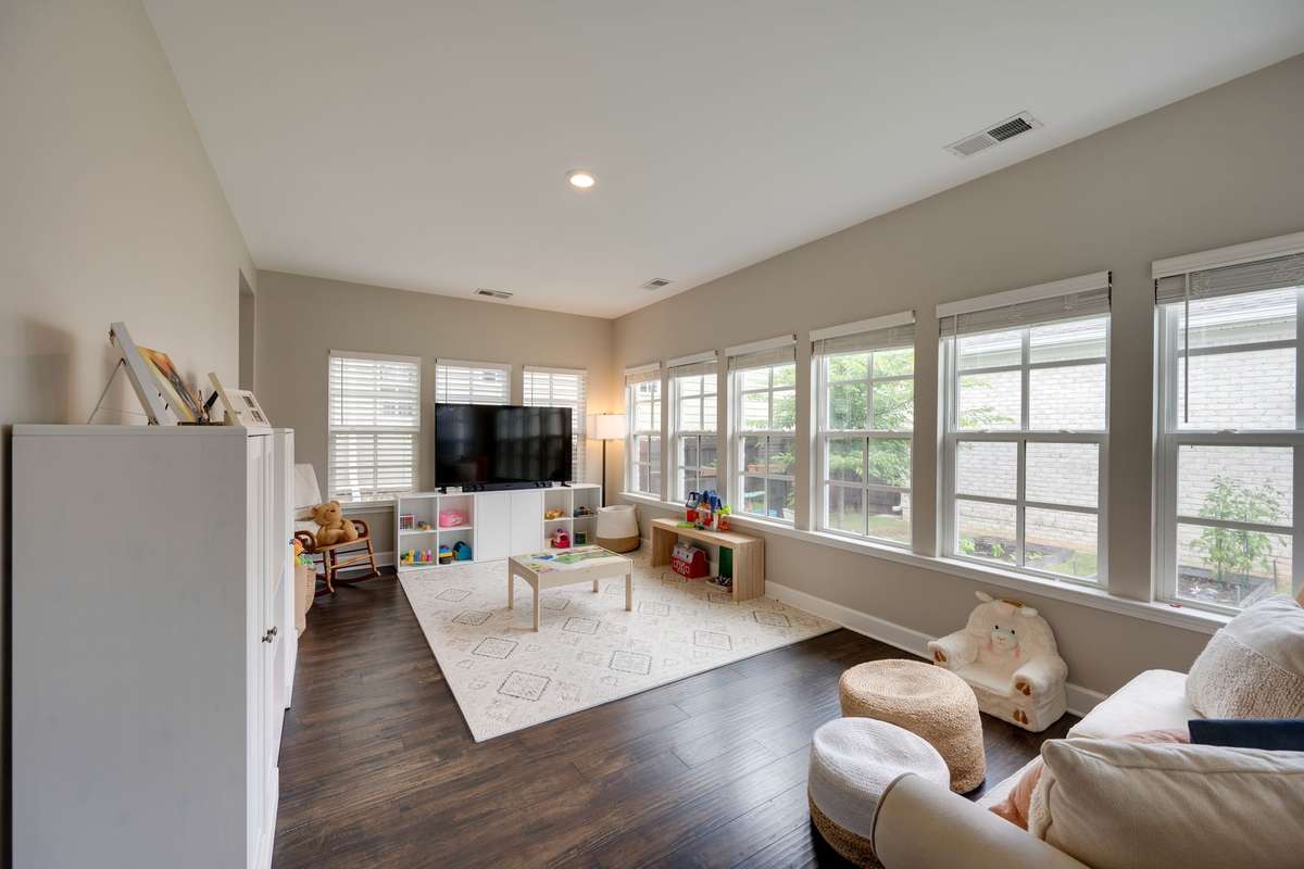 Sunroom in the back of the home! Currently being used as a playroom and 2nd living space