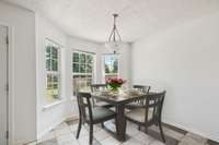 Dining area with bay windows, tile flooring & neutral color scheme. 101 Briston Ct Murfreesboro, TN 37127