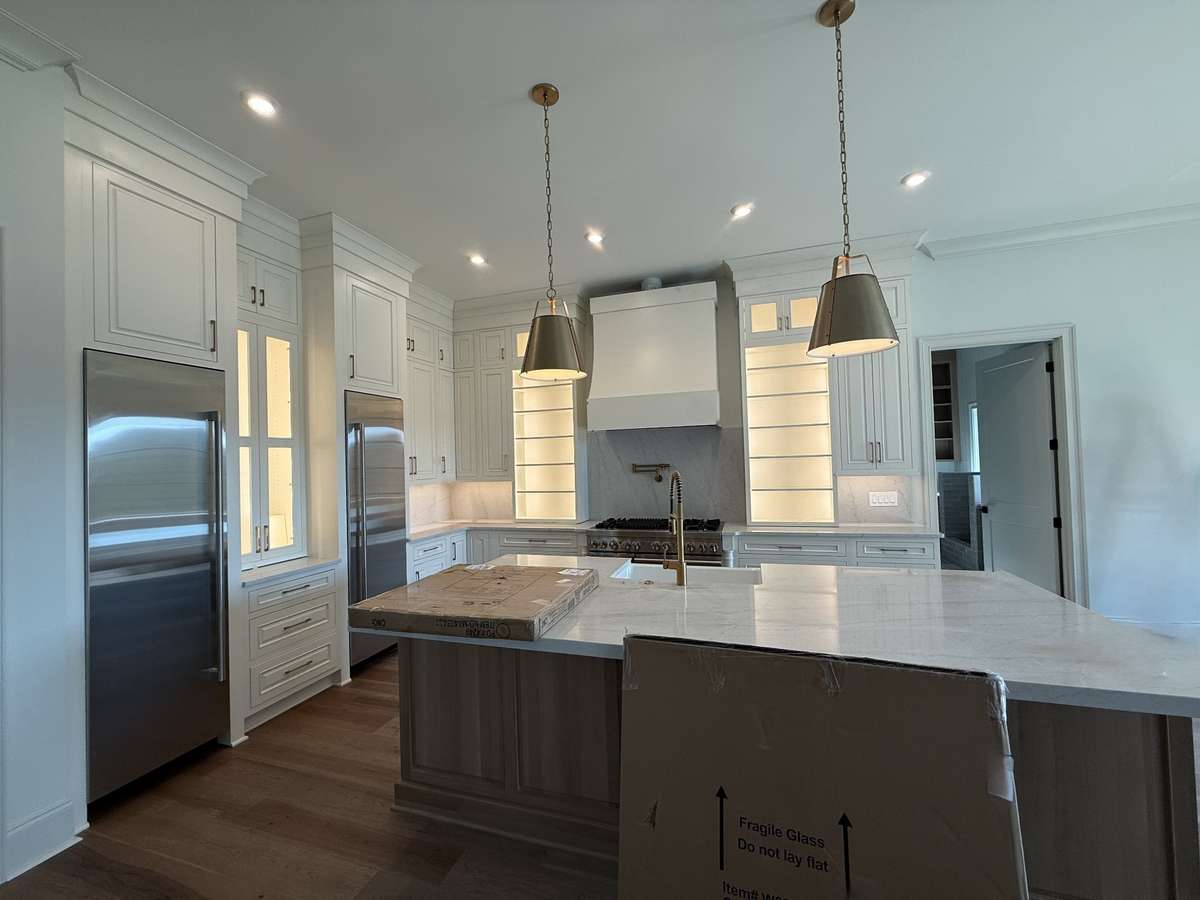 Photos represent another Rutledge plan built with custom items & reflects optional items & upgrades.