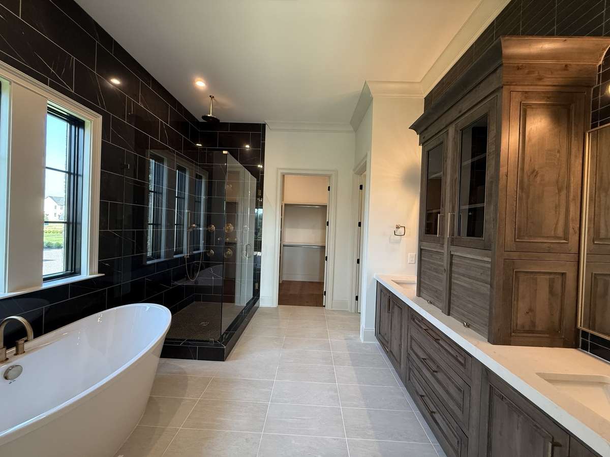 Photos represent another Rutledge plan built with custom items & reflects optional items & upgrades.