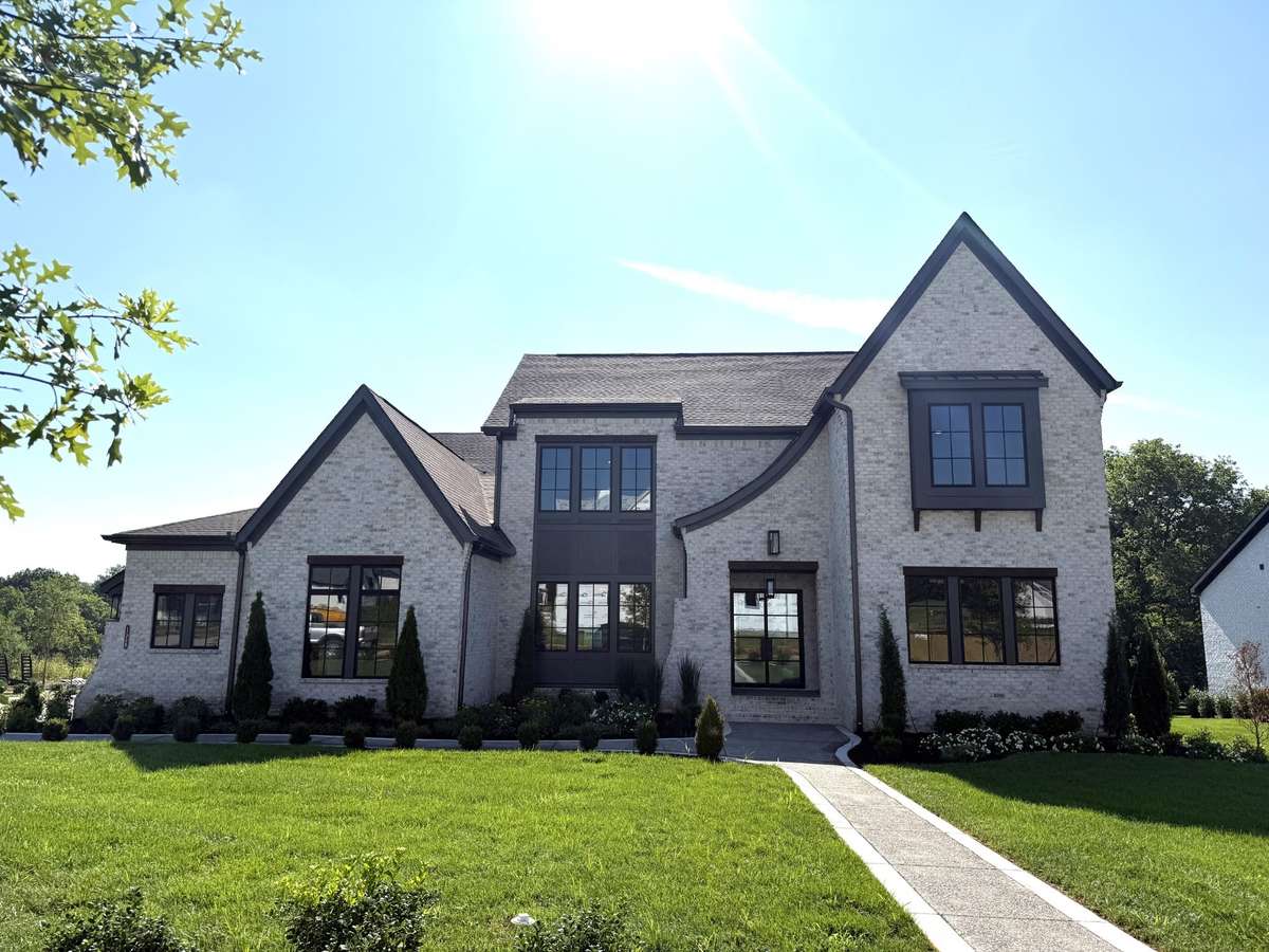 Photos represent another Rutledge plan built with custom items & reflects optional items & upgrades.