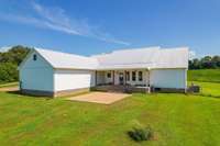 COVERED BACK PORCH TO ENJOY MORNING COFFEE AND EXPANSIVE VIEWS