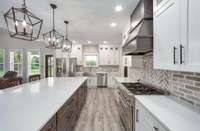 GAS RANGE AND CUSTOM HOOD