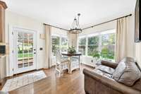 Wall to wall windows showcase views of the beautiful gardens in the backyard.