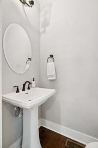 A guest bath/powder room is located downstairs and is ideal for your family and guests.