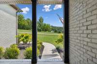 A covered front porch provides shelter and is a great place to enjoy just how peaceful it is out here...