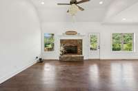 The focal point of the living room is the gas fireplace featuring a lovely, stacked stone accents for the hearth and surround...